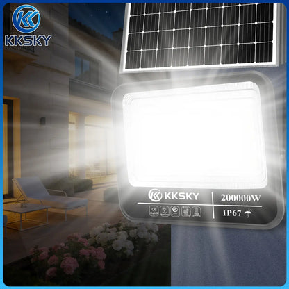 Closeup of bright KKSKY solar flood light with separate solar panel for backyard garden outdoor lighting
