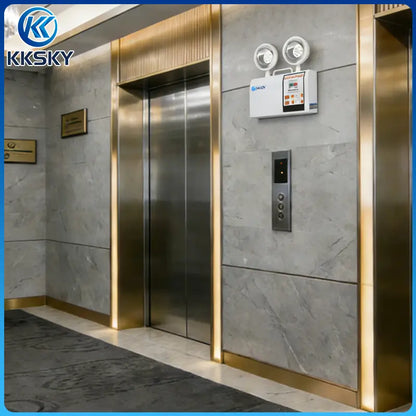 Wall mounted KKSKY twin head LED emergency light installed in elevator lobby for commercial fire emergency backup lighting