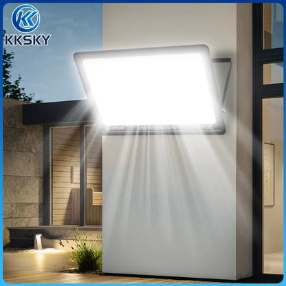 KKSKY real scene usage of Electric LED Flood Light Outdoor Waterproof installed on modern house garden yard for night exterior security lighting