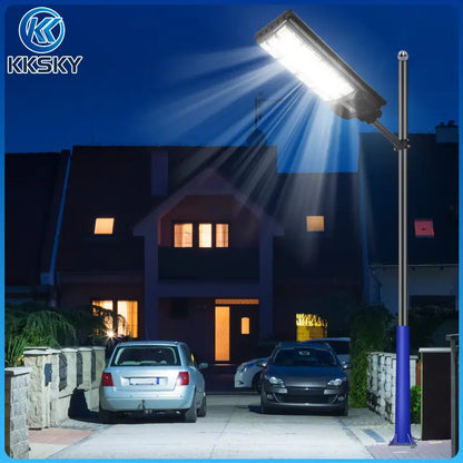 Solar street light installed on metal pole night lighting effect, bright outdoor solar flood lamp for driveway parking lot residential street